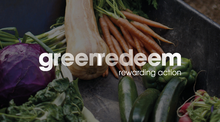 Assorted vegetables including carrots and squash. Visible text: "greenredeem rewarding action".