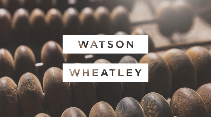Close-up of wooden abacus beads. Text: "WATSON WHEATLEY".