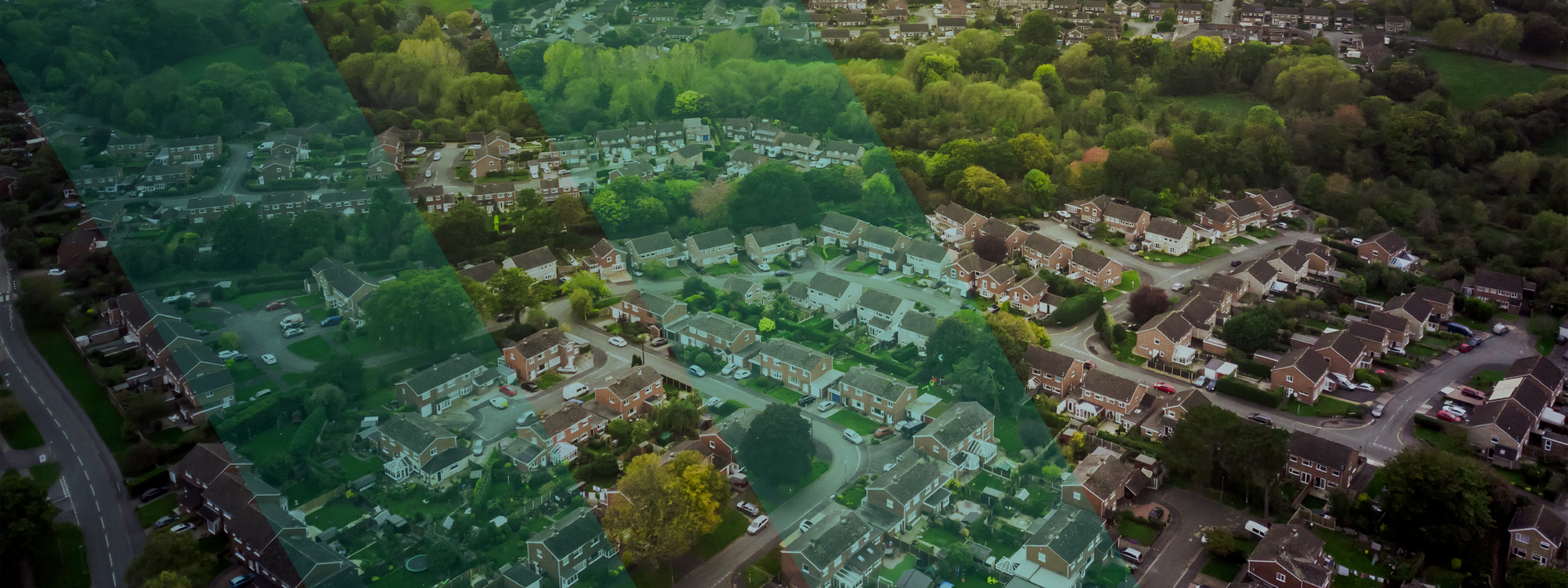 Aerial view of suburban neighborhood with trees. No visible text.
