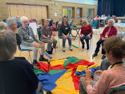 A picture of Anna working with visitors to the Eynsham Day Centre