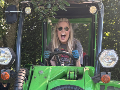 Hannah pictured in a mini digger (that she wasn't allowed to drive)